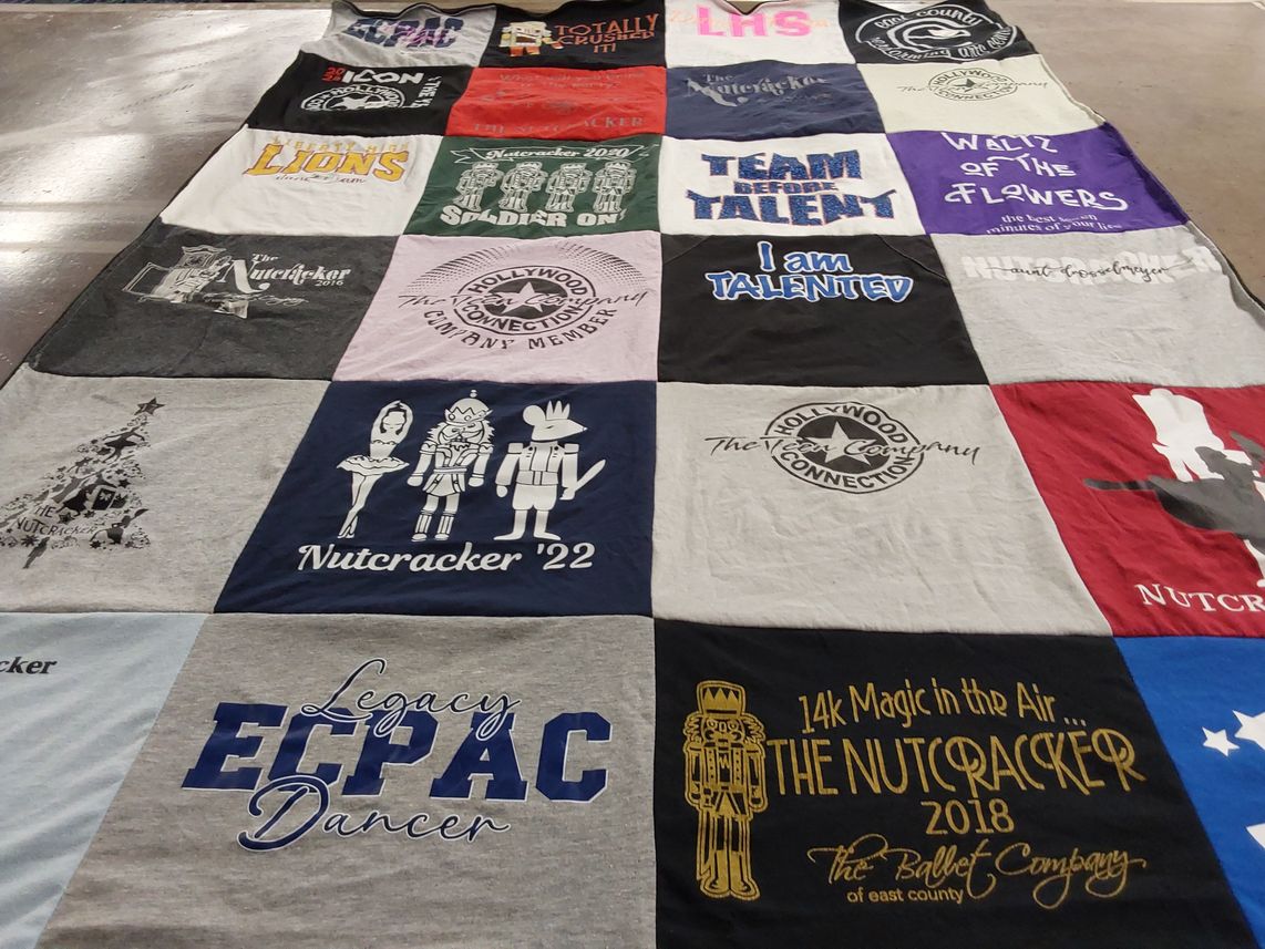 T-shirt quilt with dance, theater themes by Julie from CA