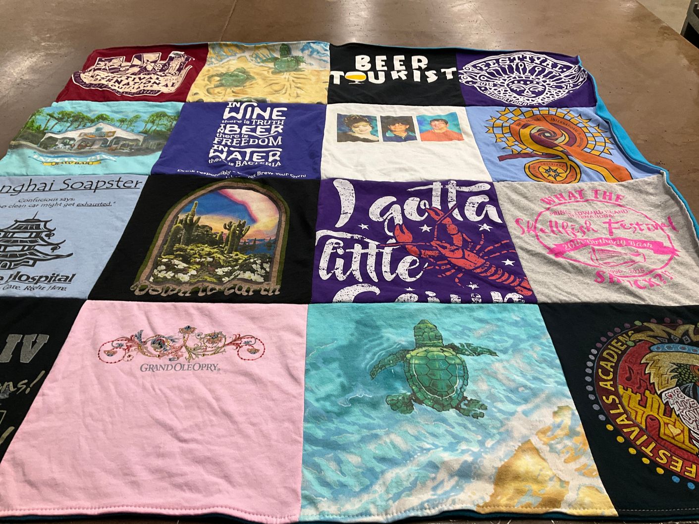 T-shirt quilt with tours, festivals themes by Tim from LA