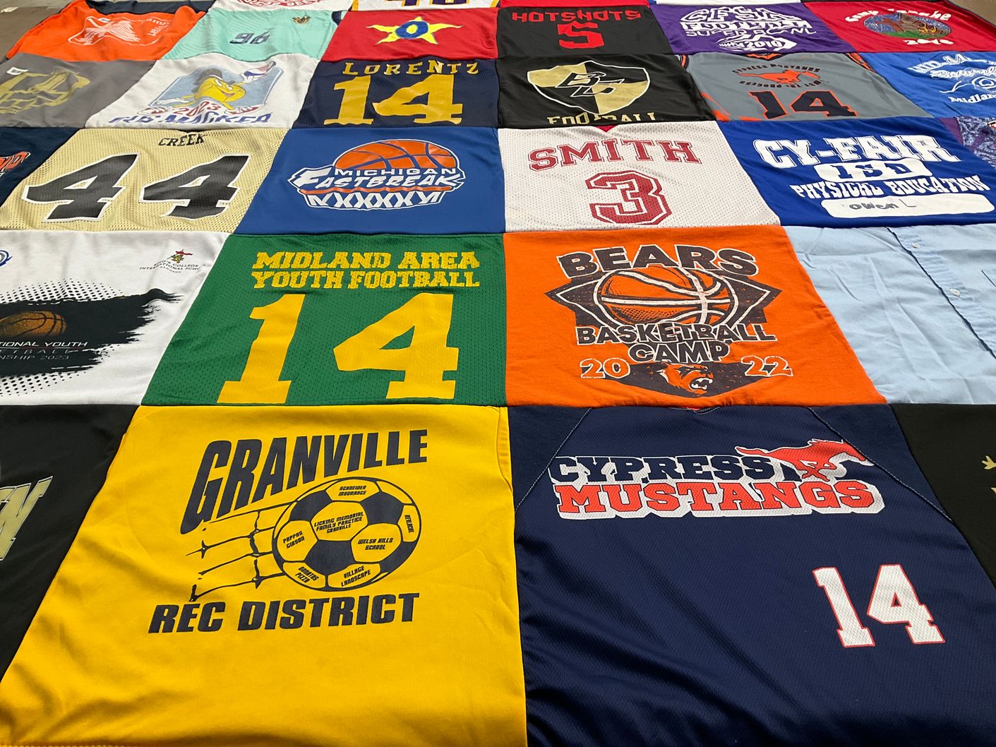 T-shirt quilt featuring cypress mustangs, granville rec district by Laura from TX