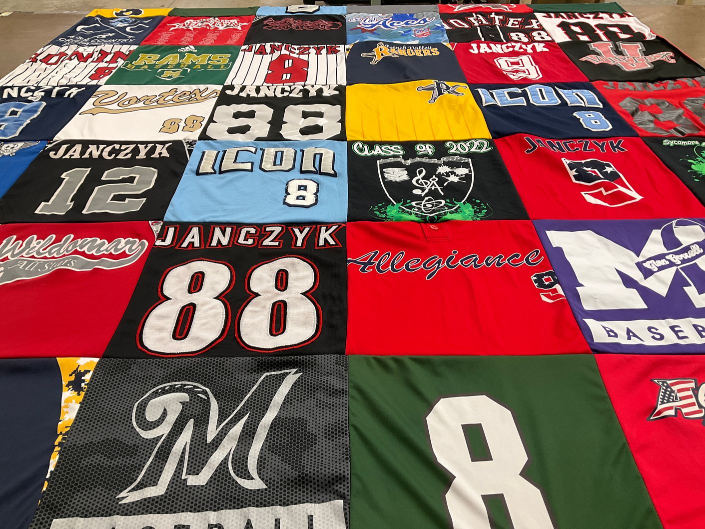 T-shirt quilt with sports, music themes by Gwen from CA