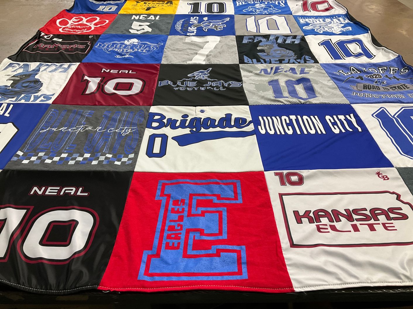 T-shirt quilt featuring junction city blue jays, blue jays football by Rina from KS