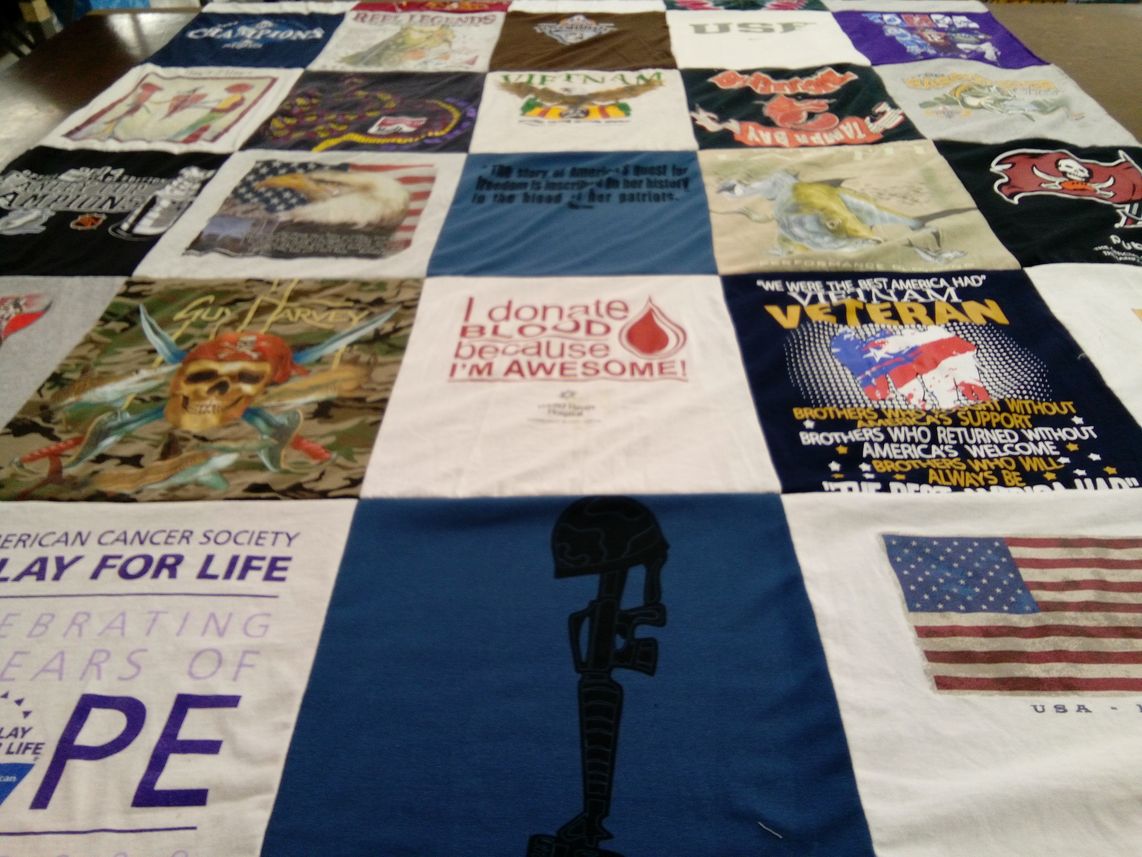 T-shirt quilt with veterans, cancer awareness themes by Hilda from GA