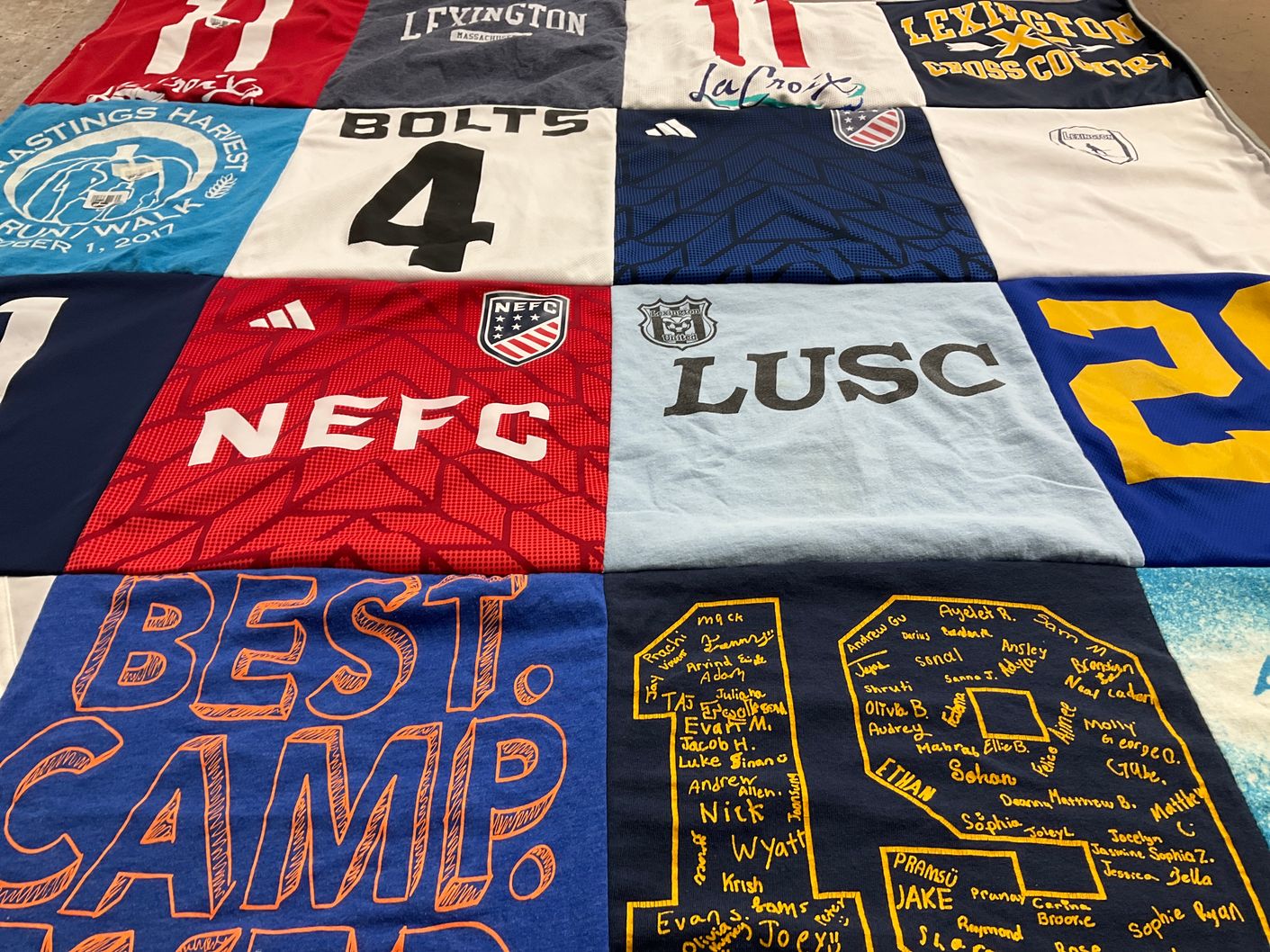 T-shirt quilt featuring north east football club, lexington cross country by Katie from MA
