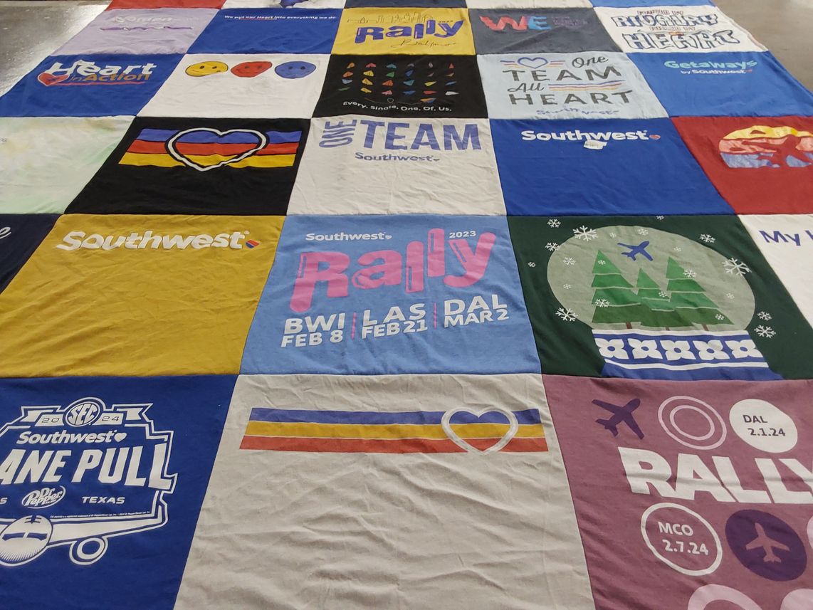 T-shirt quilt with travel, community themes by Laura from TX