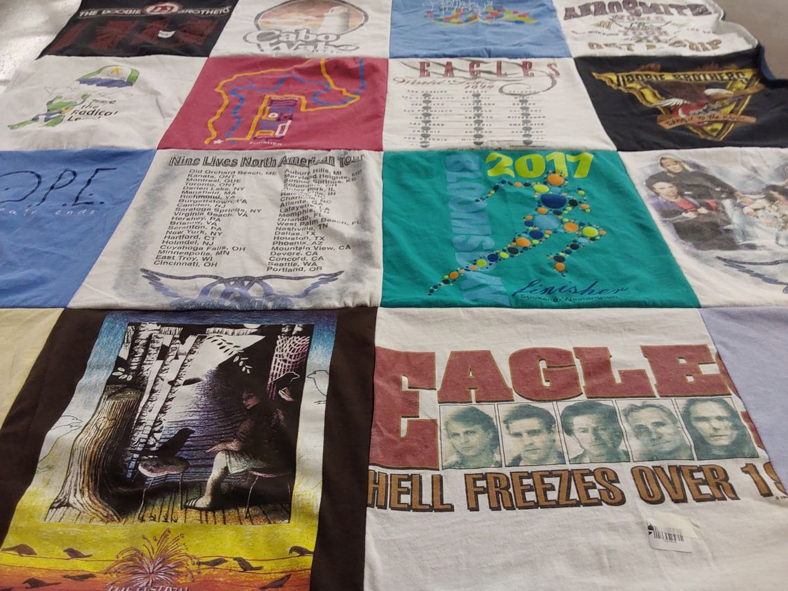 T-shirt quilt with music, concerts themes by Kathleen from ID