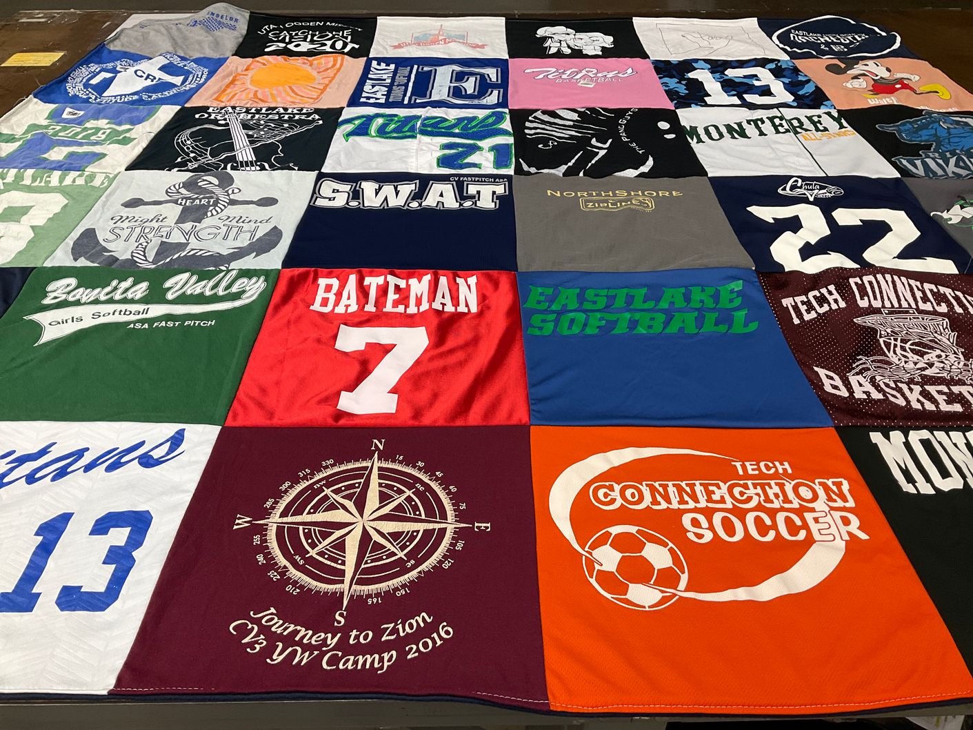 T-shirt quilt with softball, soccer themes by Kate from CA