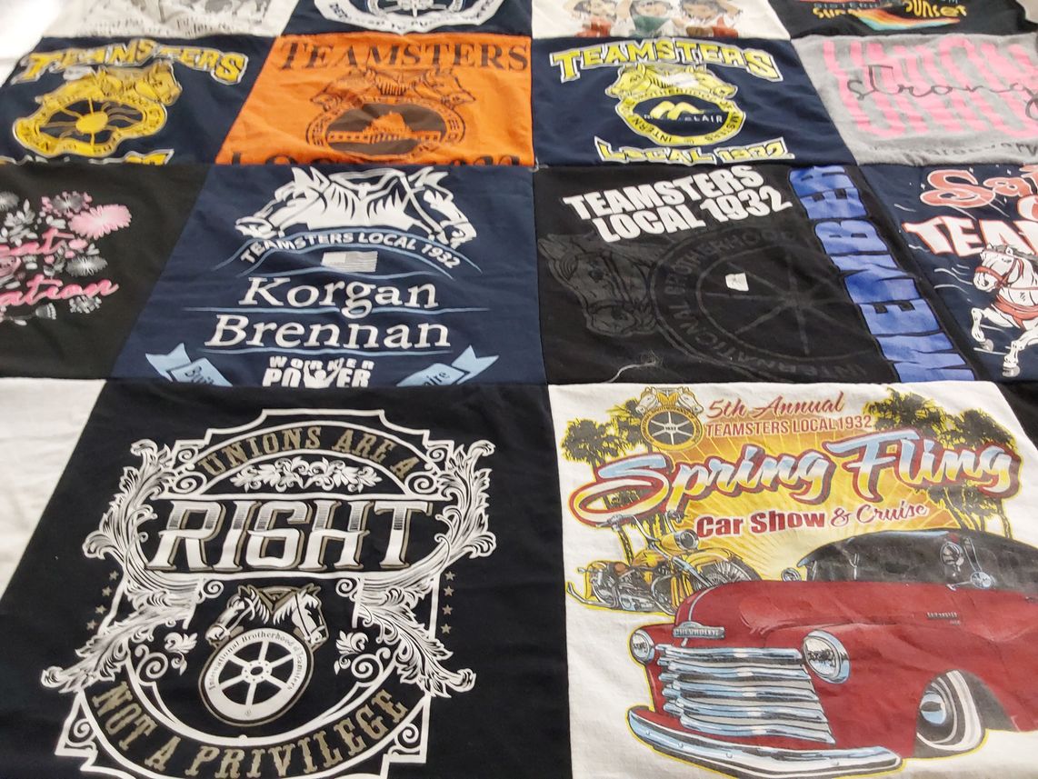 T-shirt quilt with labor rights, union activities themes by Michelle from CA