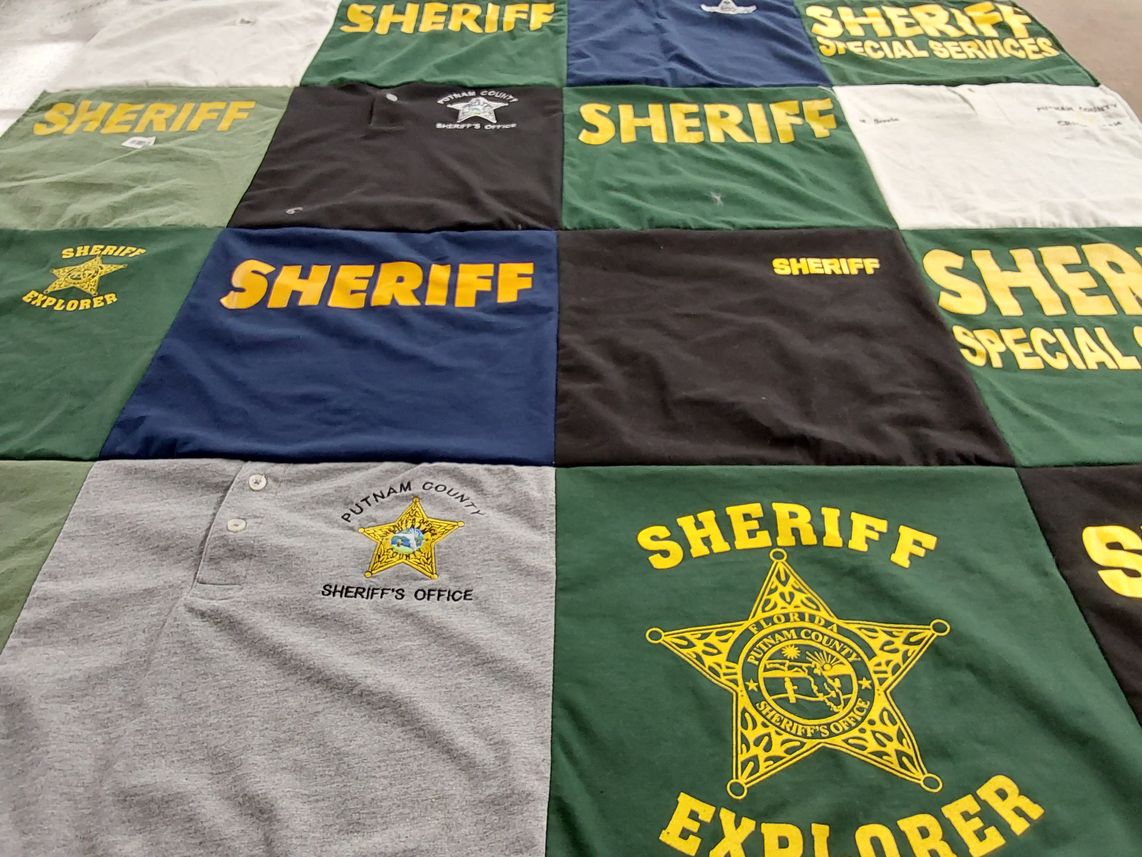 T-shirt quilt with law enforcement themes by Pamela from FL