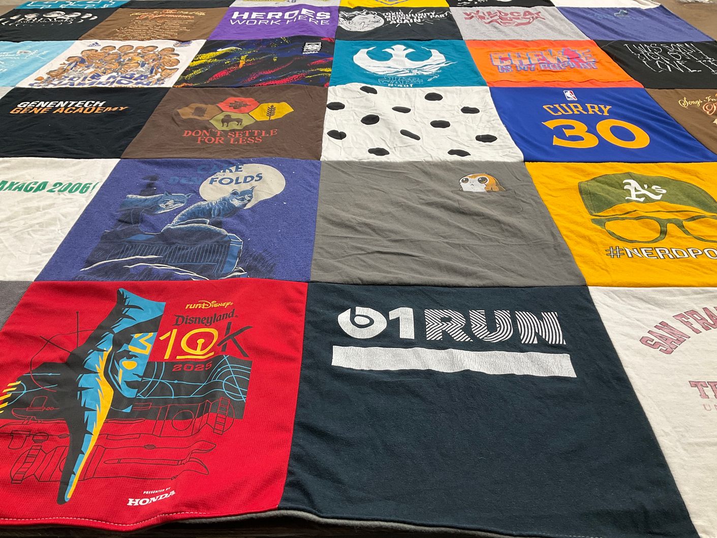 T-shirt quilt with running, sports themes by Christine from CA