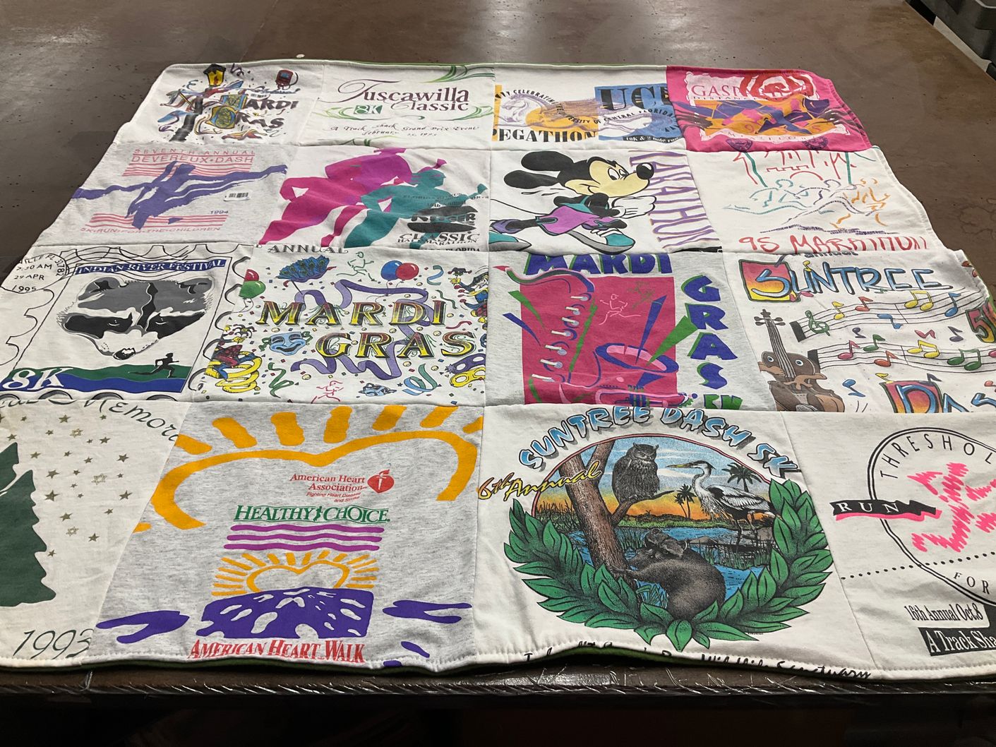 T-shirt quilt with local festivals, community events themes by Dorothy from FL