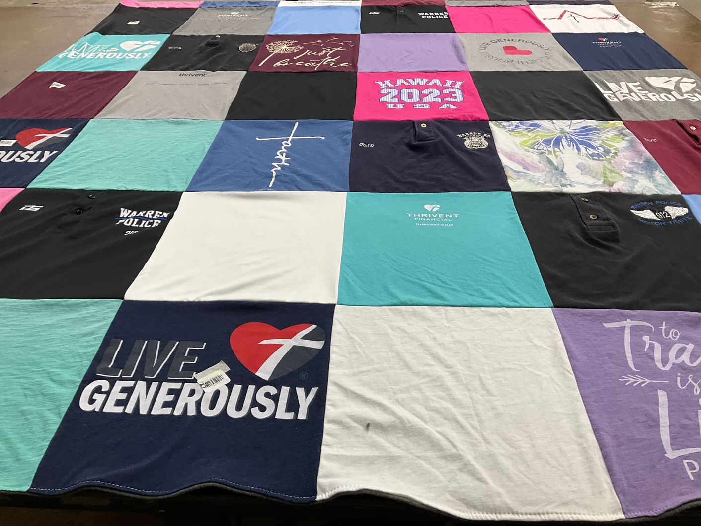 T-shirt quilt with community service, philanthropy themes by Barbara from MI