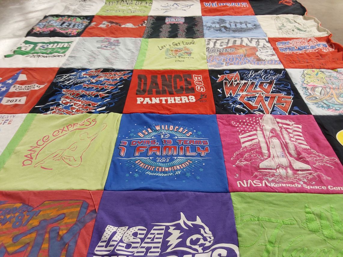 T-shirt quilt with dance, athletics themes by Ann from CT