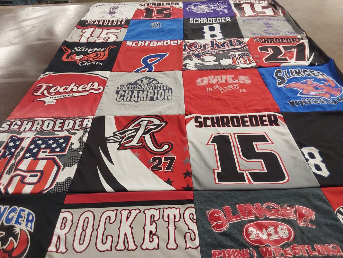T-shirt quilt featuring rockets baseball, slinger wrestling by Kelly from WI