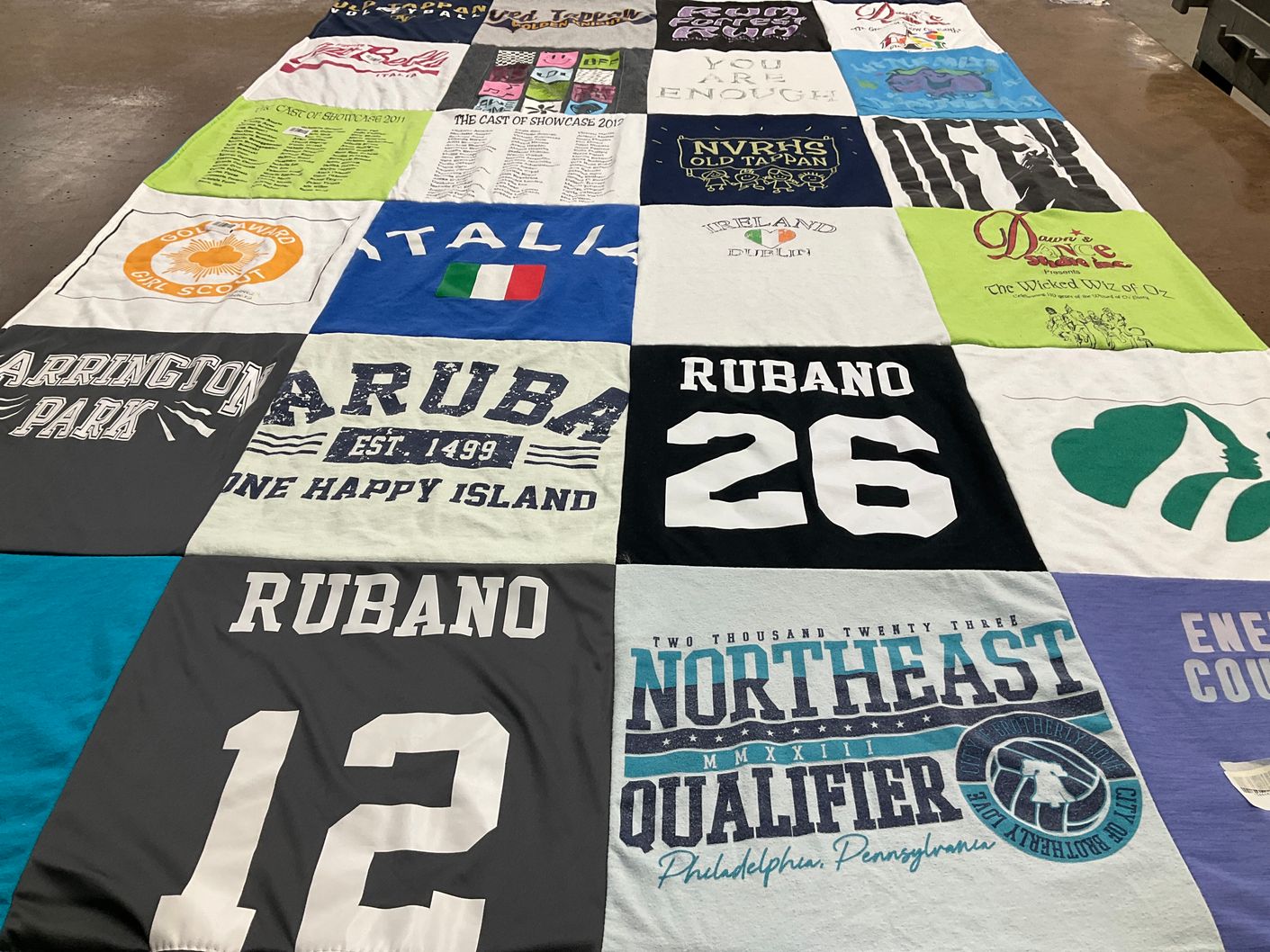 T-shirt quilt with travel, theater themes by Anna from NJ