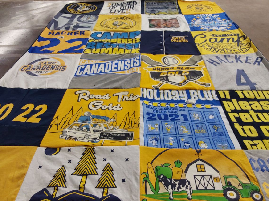 T-shirt quilt with camping, sports themes by Pam from NY