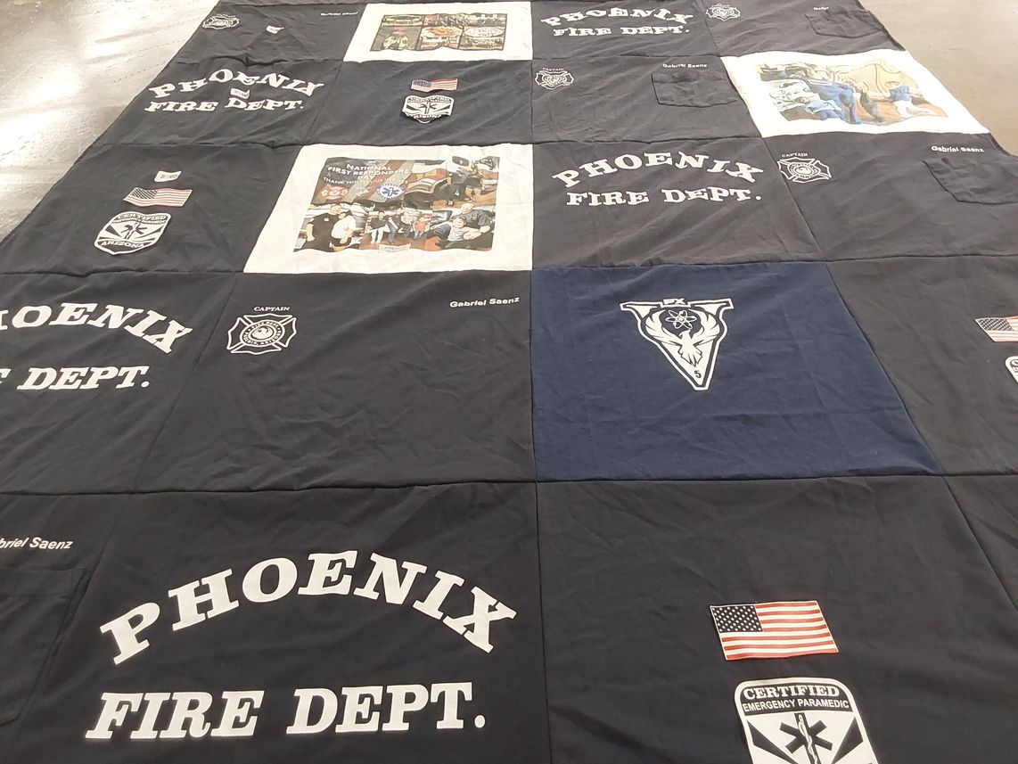 T-shirt quilt with firefighting, emergency services themes by Patricia from AZ