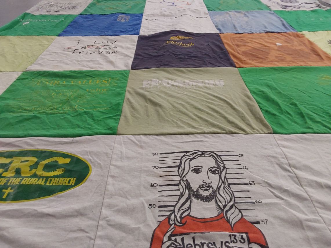 T-shirt quilt with religion, sports themes by Nancy from VA
