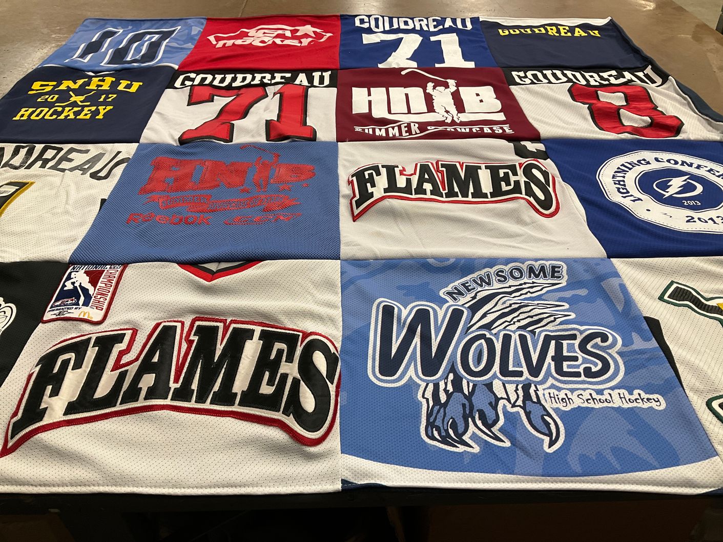 T-shirt quilt featuring newsome high school hockey, flames by Kelly from NH