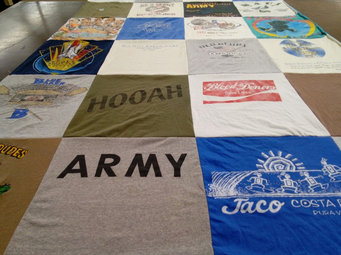 T-shirt quilt with camping, blood donation themes by Lisa from TX