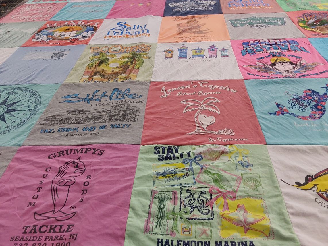 T-shirt quilt with beach, fishing themes by Mona from GA
