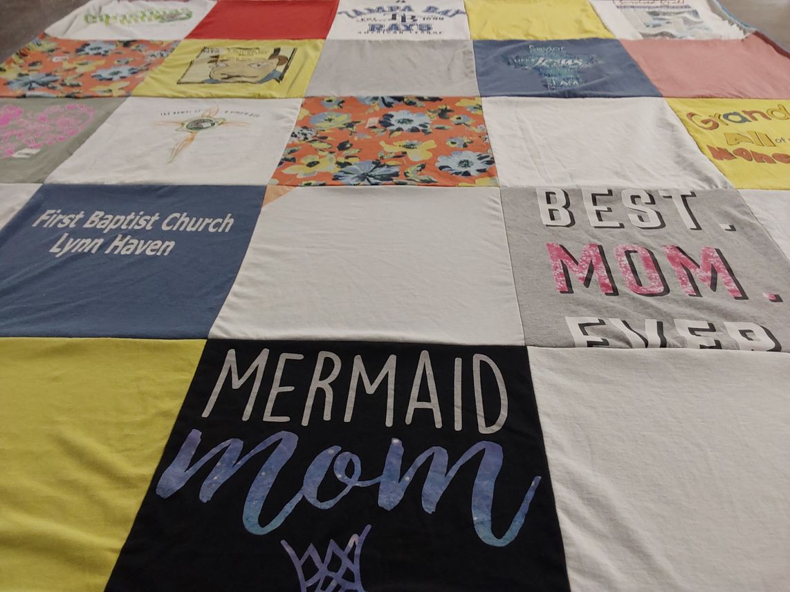 T-shirt quilt with family, community themes by Ruth from FL