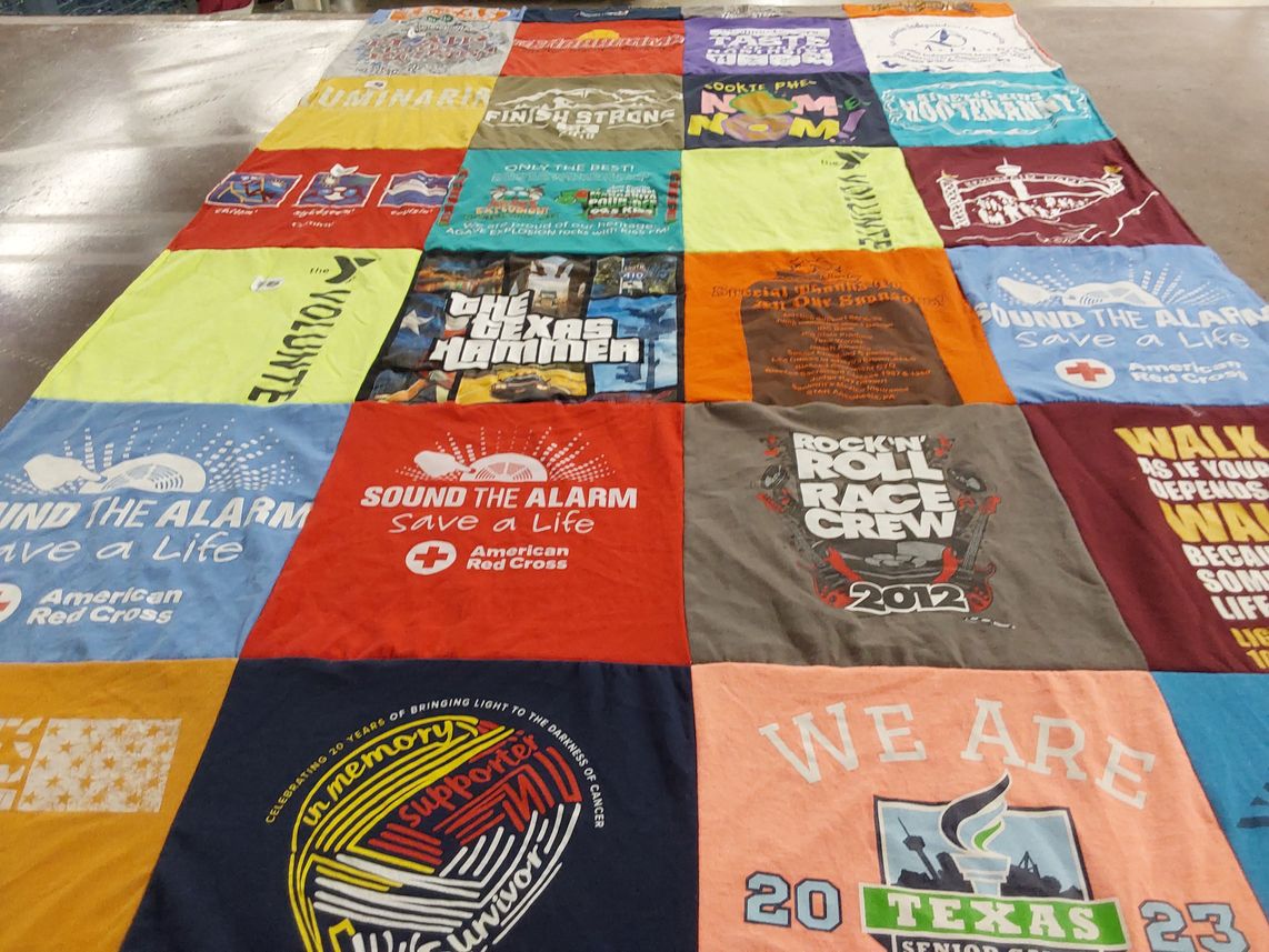 T-shirt quilt with volunteering, charity themes by Evelyn from TX