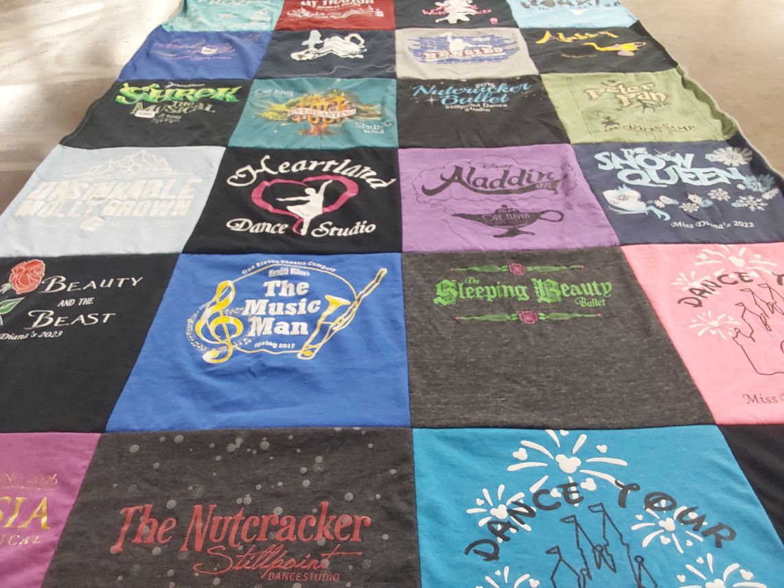 T-shirt quilt with dance, theater themes by Erica from OR