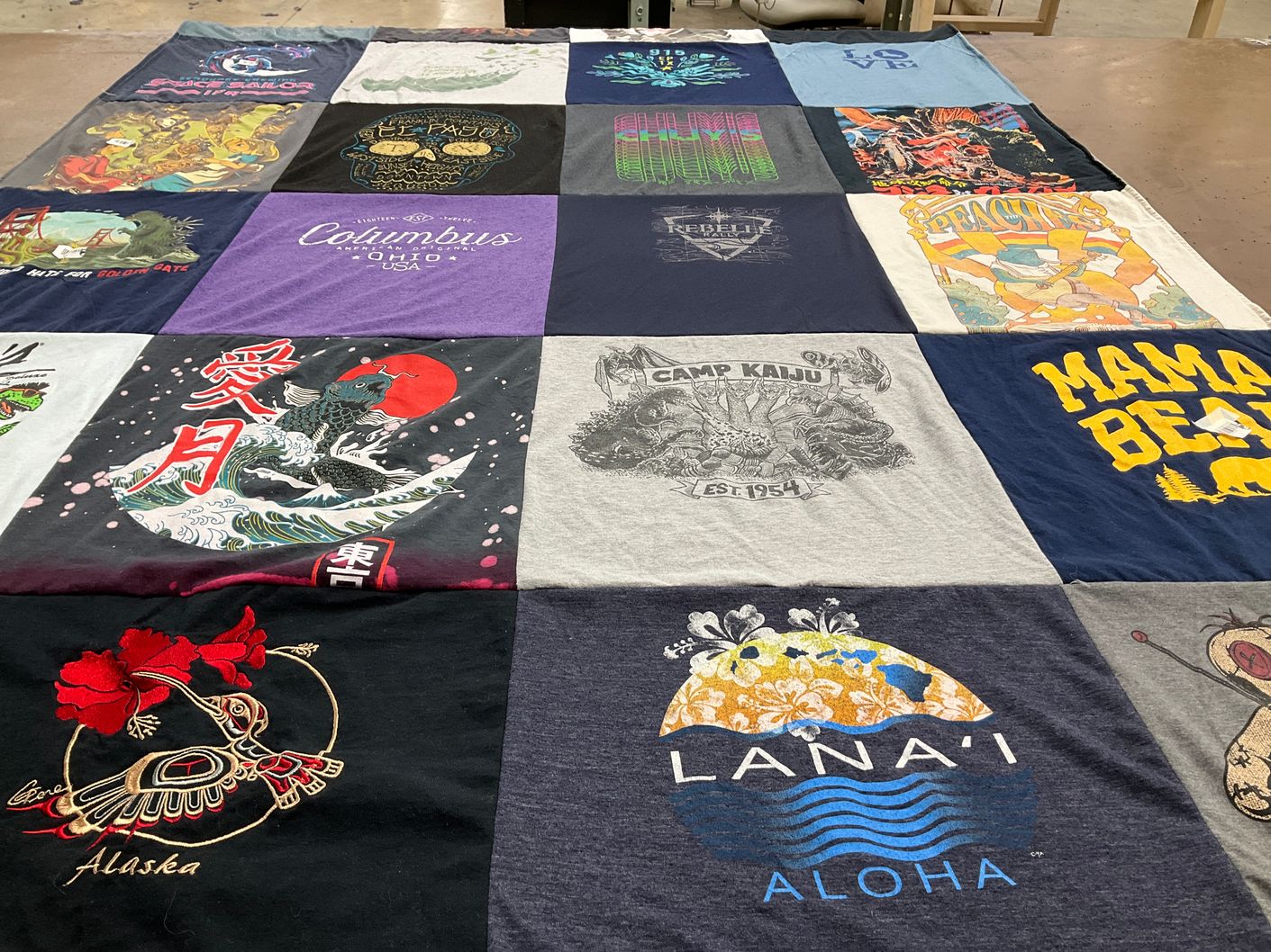 T-shirt quilt with travel, arts themes by Laura from CA
