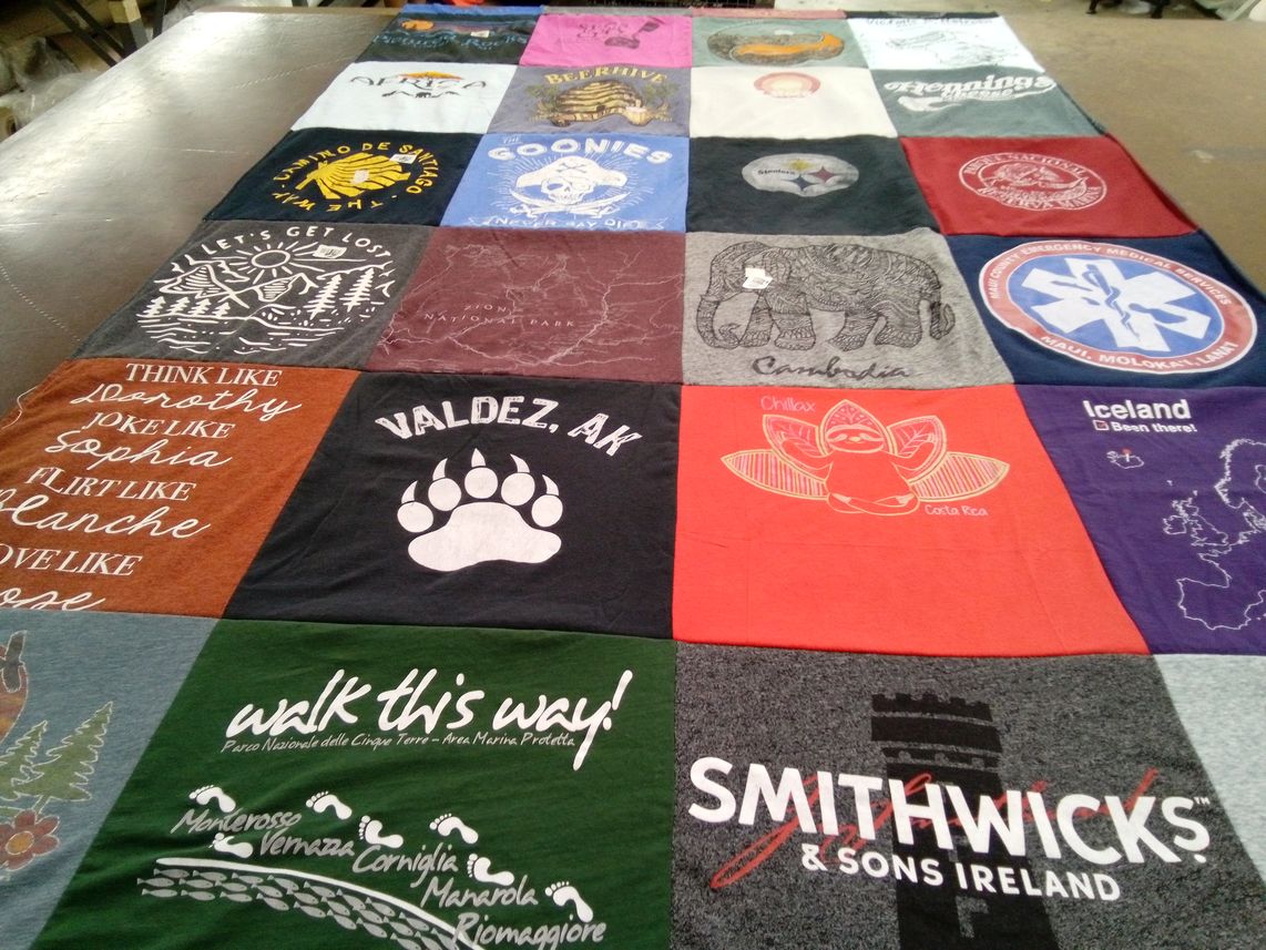 T-shirt quilt with travel, adventure themes by Jill from OR