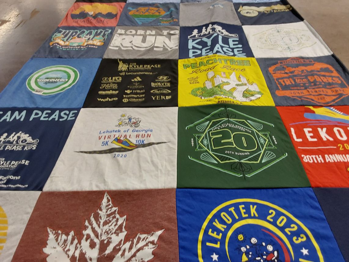 T-shirt quilt with running, charity events themes by Camille from GA