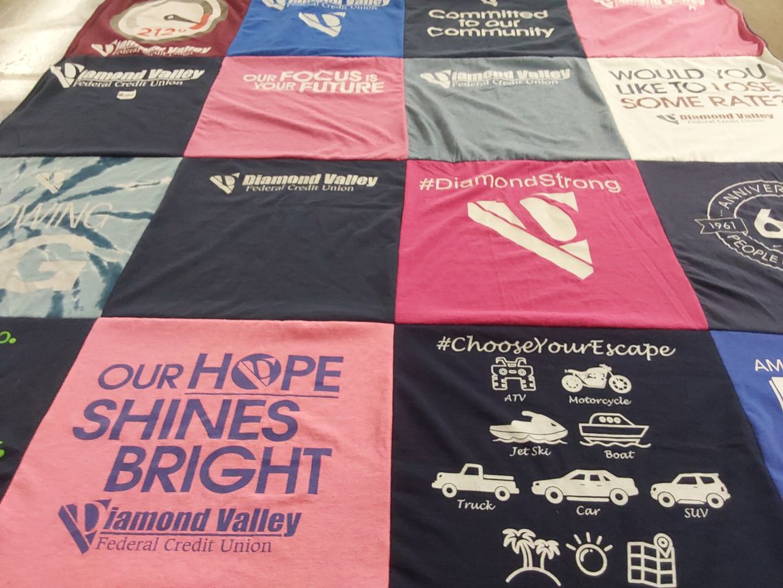 T-shirt quilt with community service, financial planning themes by Heather from IN