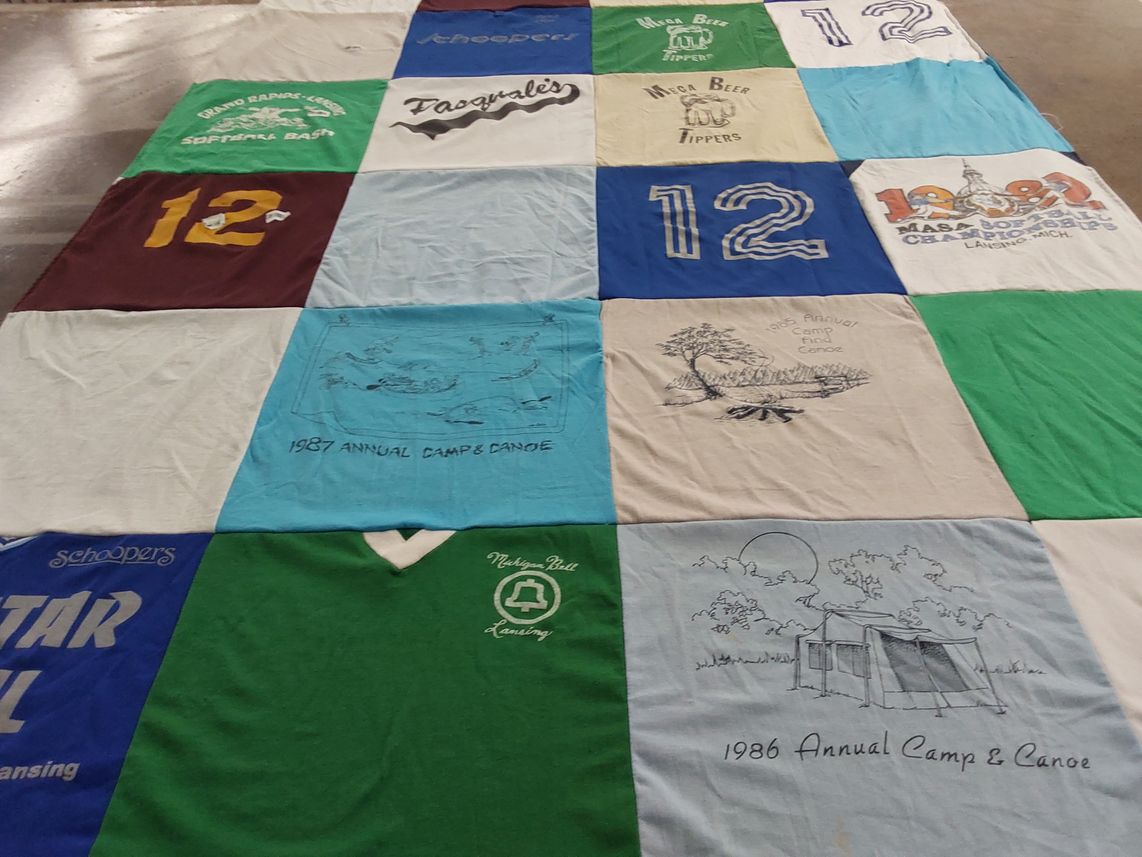 T-shirt quilt with camping, sports themes by Janet from MI