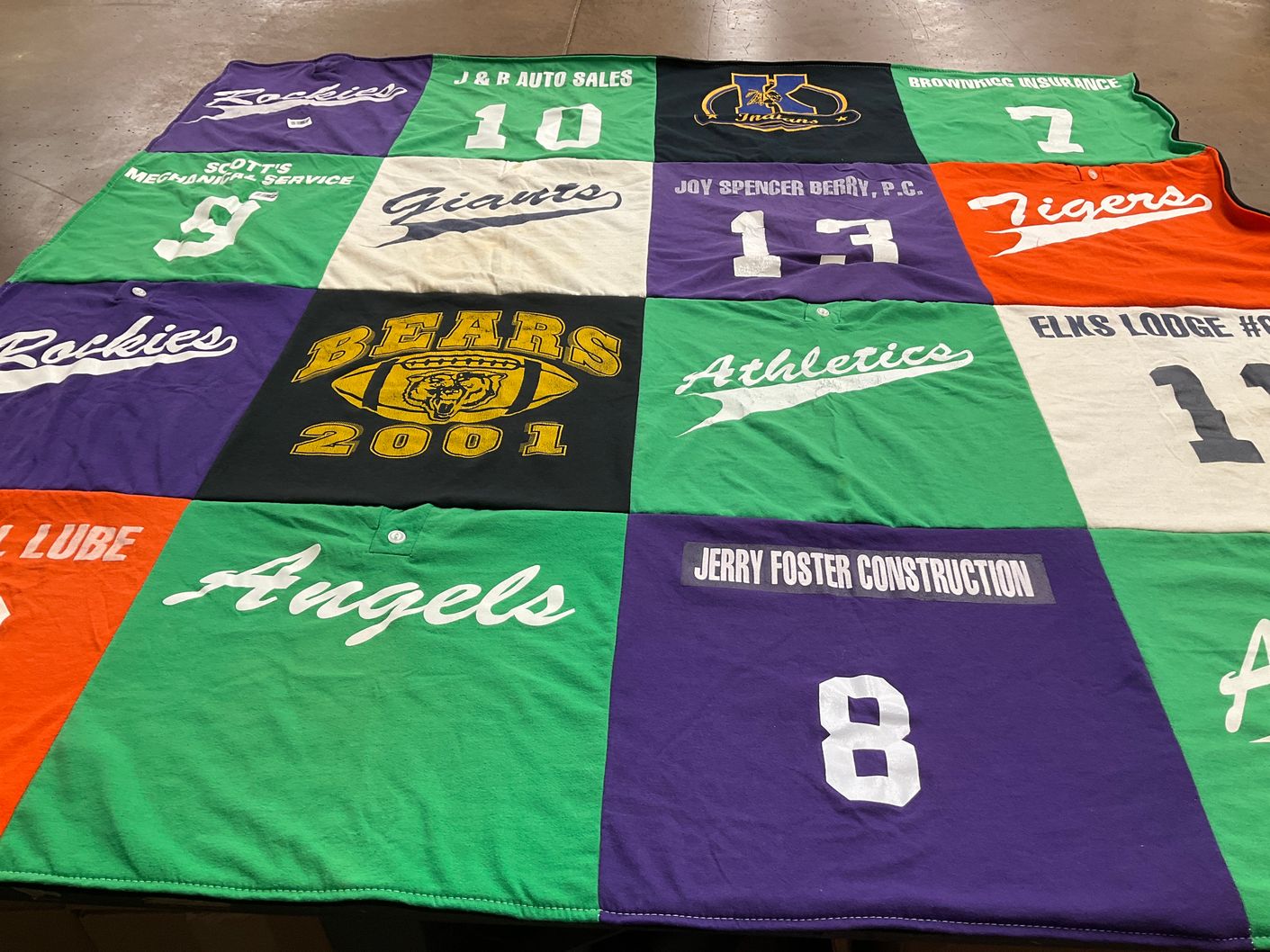 T-shirt quilt with sports, community themes by Paula from CO