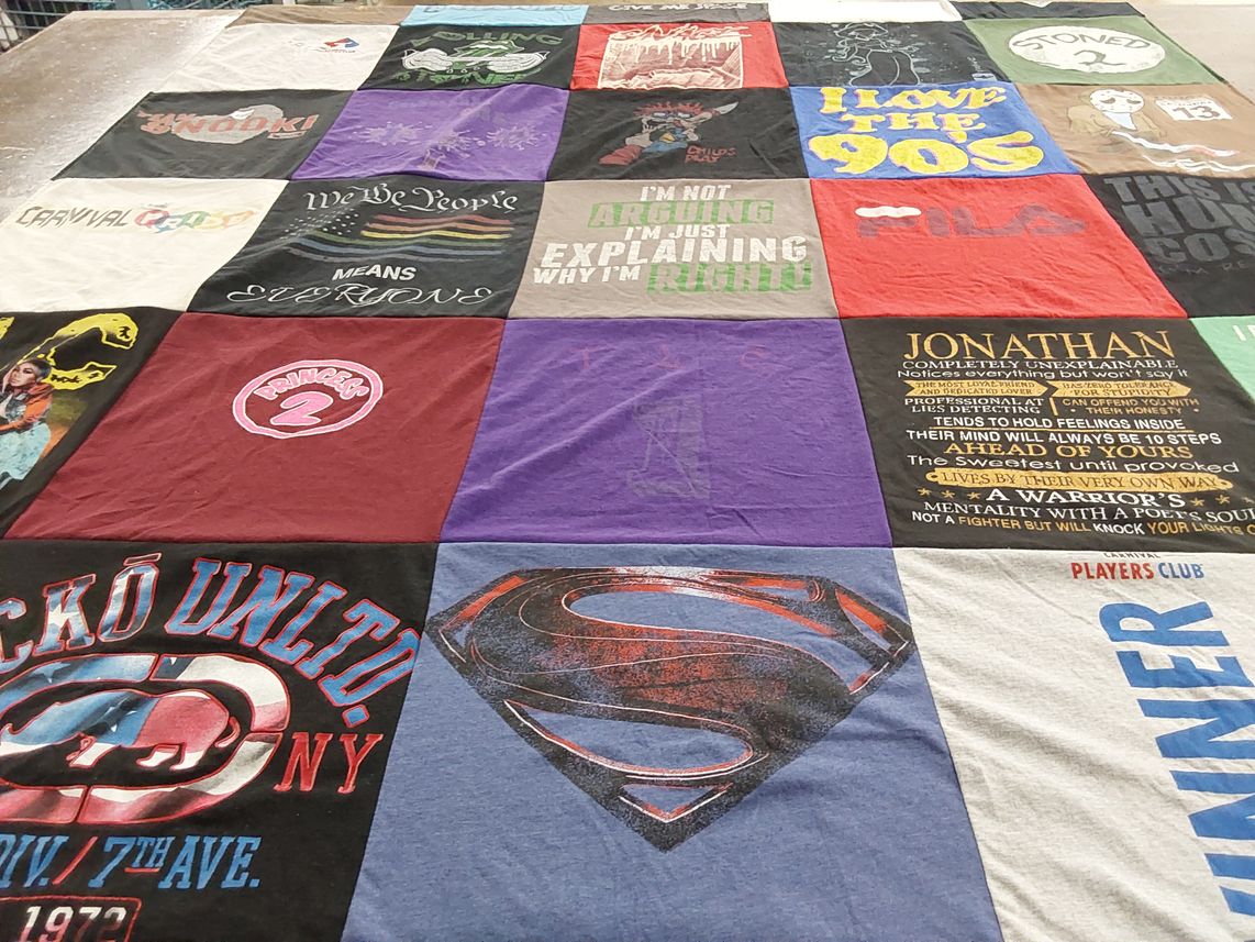 T-shirt quilt with 90s, carnival themes by Pamela from FL