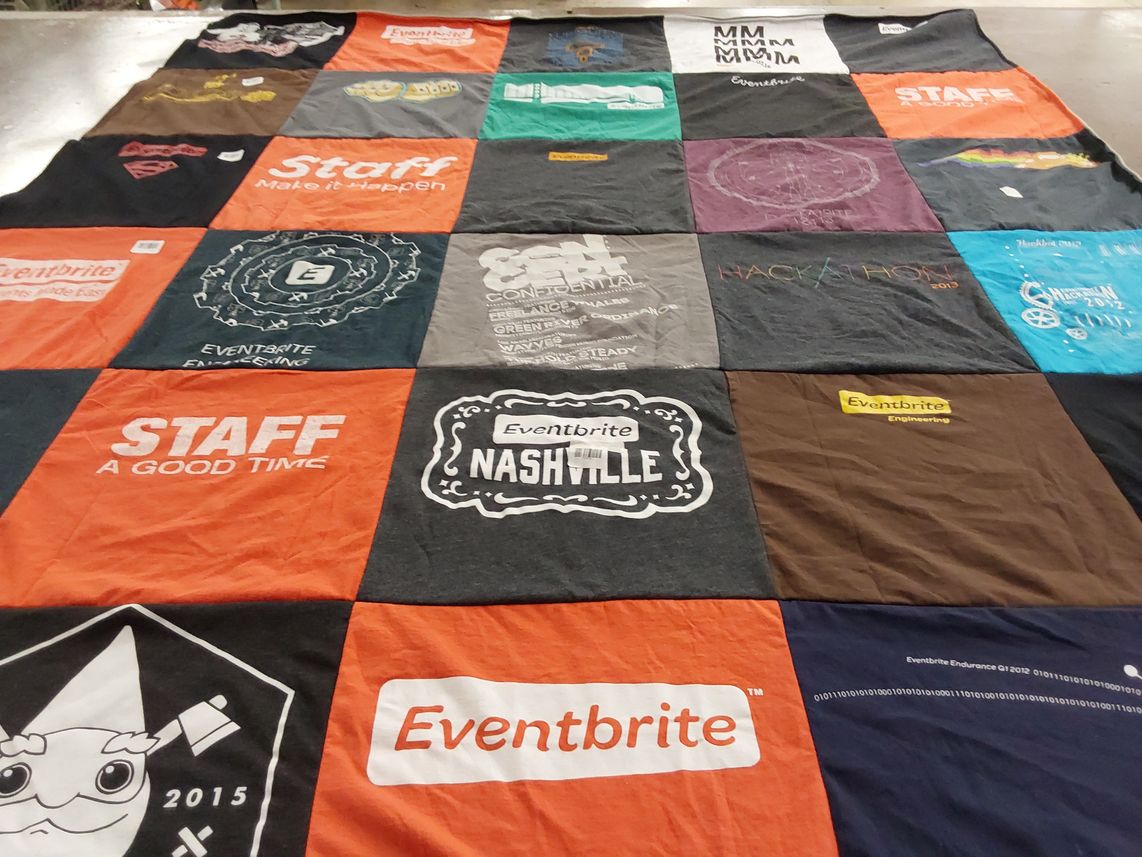 T-shirt quilt with event organization, software engineering themes by Jacqueline from CA
