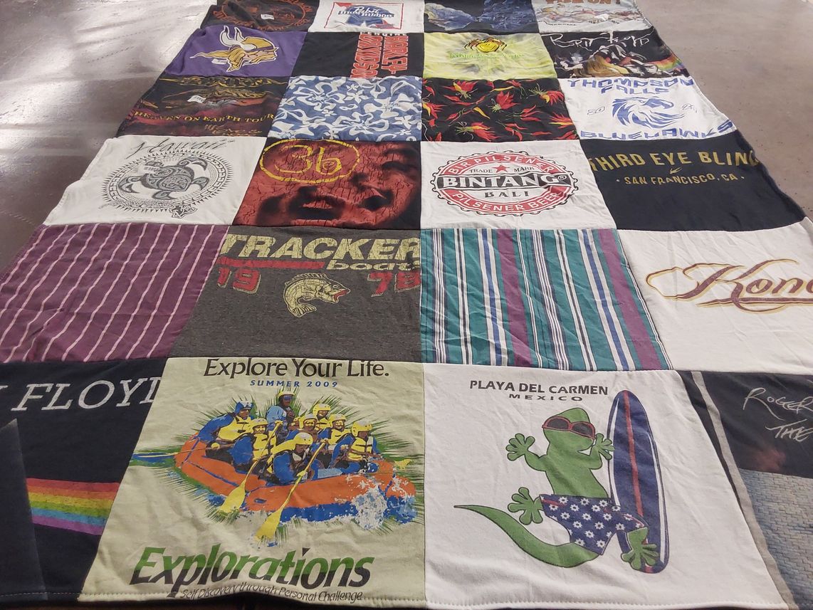 T-shirt quilt with exploration, travel themes by Melissa from MT