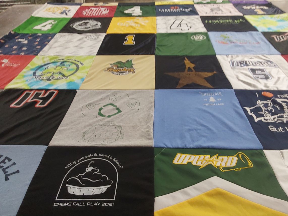 T-shirt quilt with theater, camping themes by Janine from PA