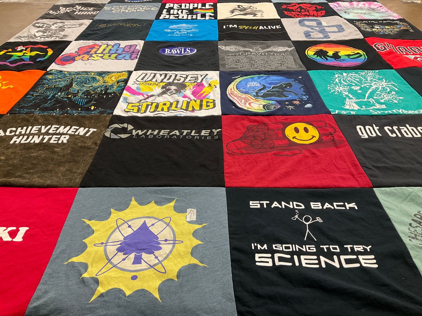 T-shirt quilt with science, gaming themes by Allison from IN