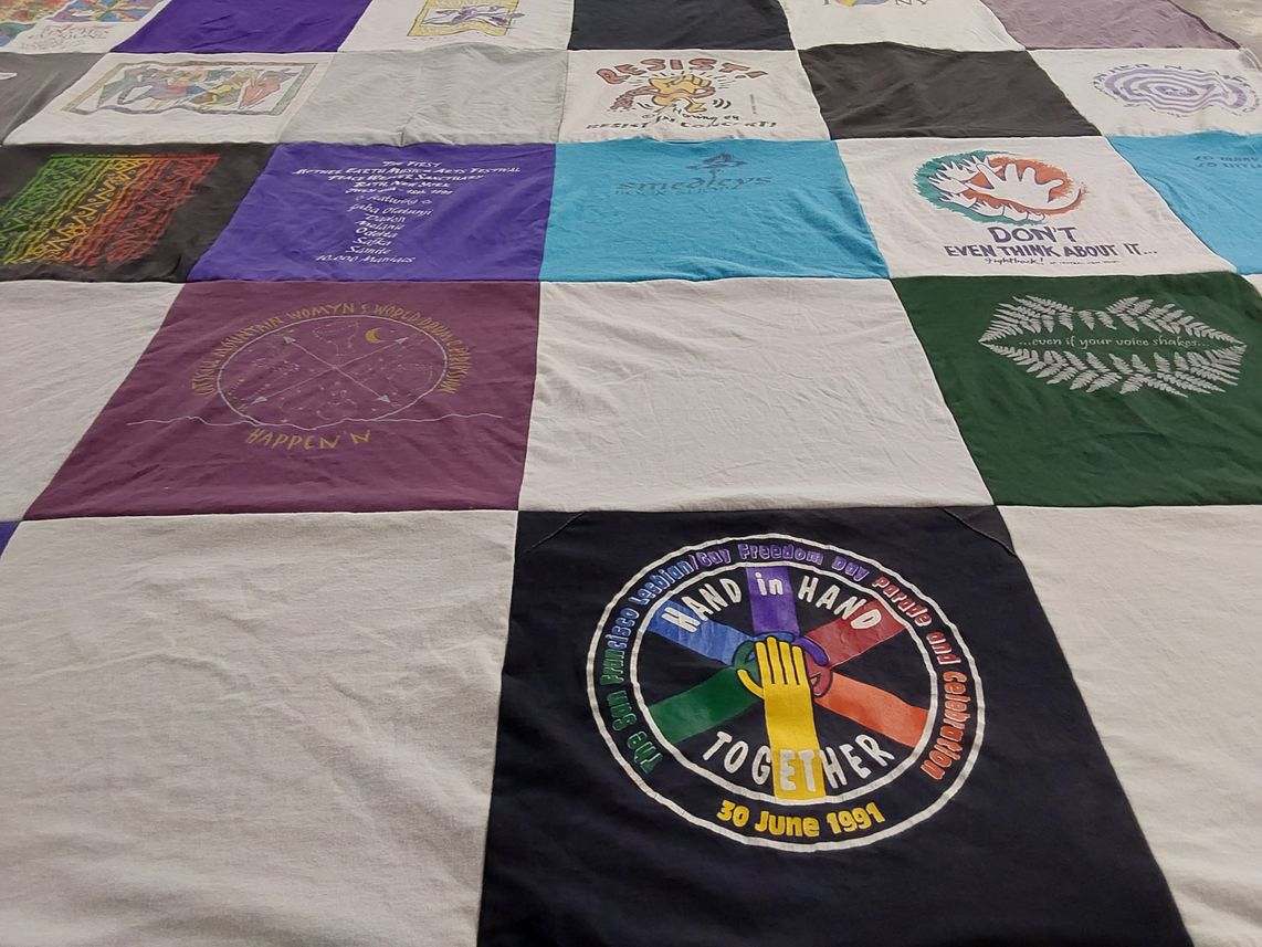 T-shirt quilt with activism, community themes by Lois from NY