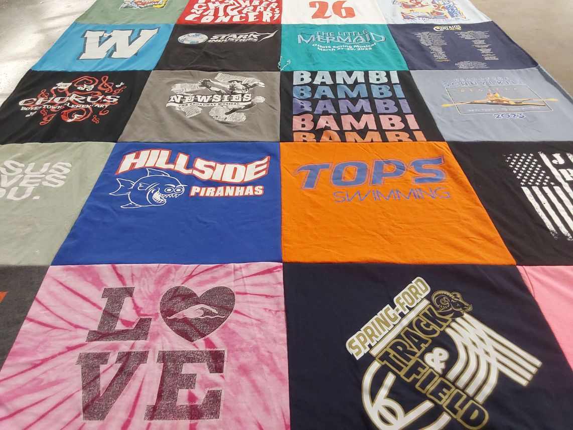 T-shirt quilt featuring hill-sides piranhas, tops swimming by Rebecca from PA
