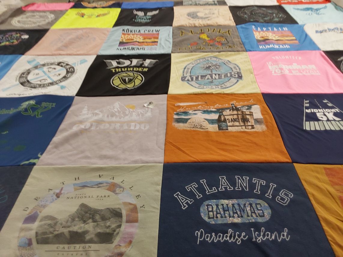 T-shirt quilt with travel, adventure themes by Debbie from UT
