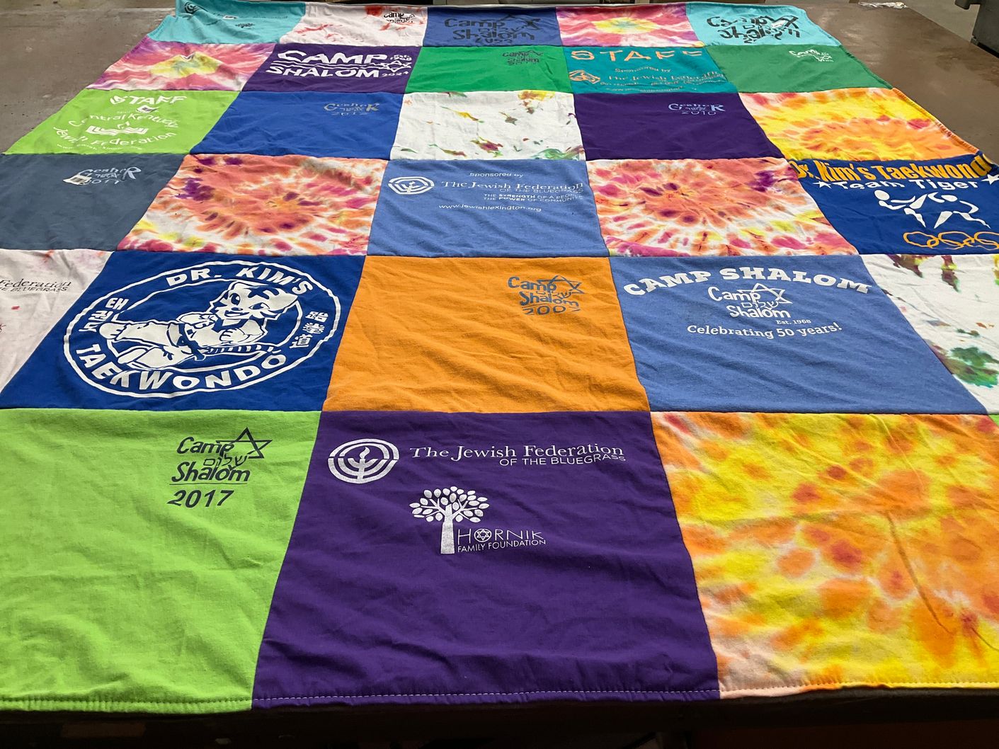 T-shirt quilt with camping, taekwondo themes by Tamara from KY