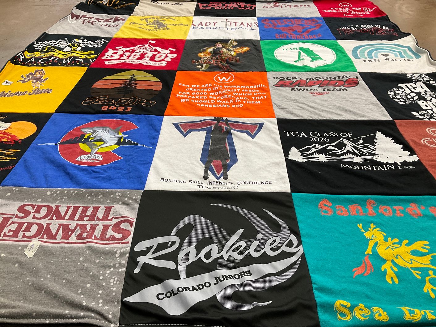 T-shirt quilt featuring rocky mountain rapids swim team by Nicola from CO