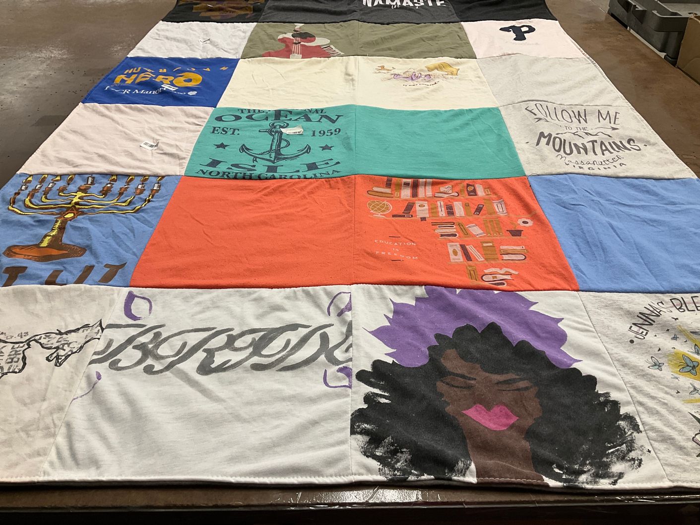 T-shirt quilt with art, education themes by Caleb from PA