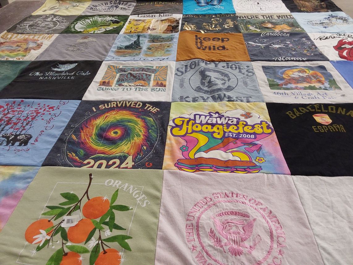 T-shirt quilt with travel, food festivals themes by Lisa from FL