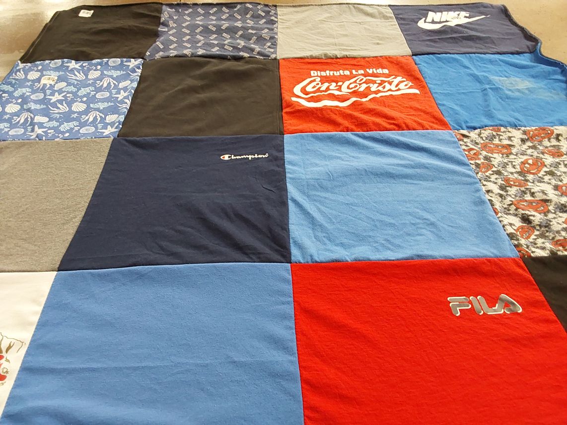 T-shirt quilt with sports, fashion themes by Mary from MA