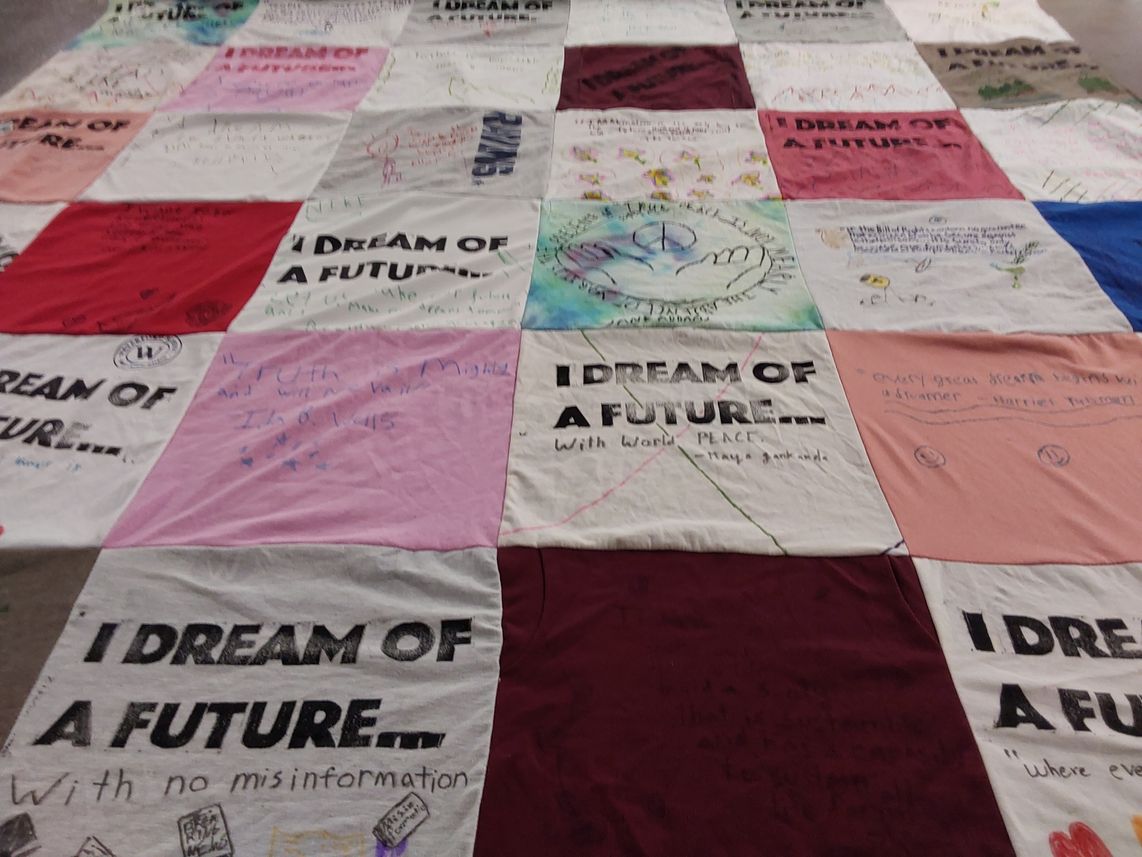 T-shirt quilt with activism, community themes by Mario from UT