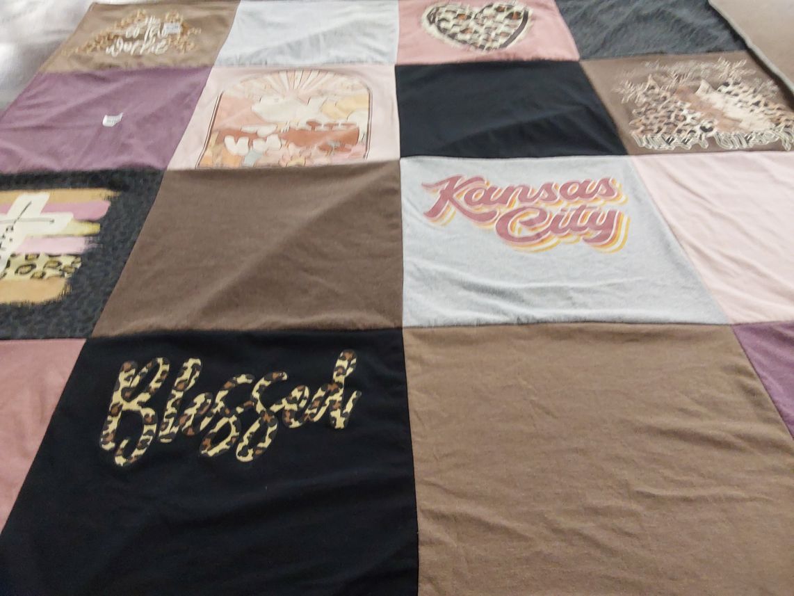 T-shirt quilt with quilting, textiles themes by Deborah from KS