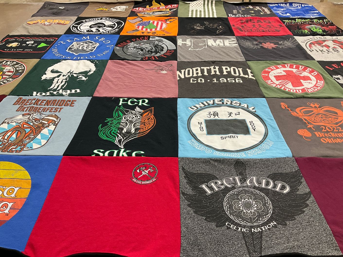T-shirt quilt with karate, hiking themes by Selina from CO