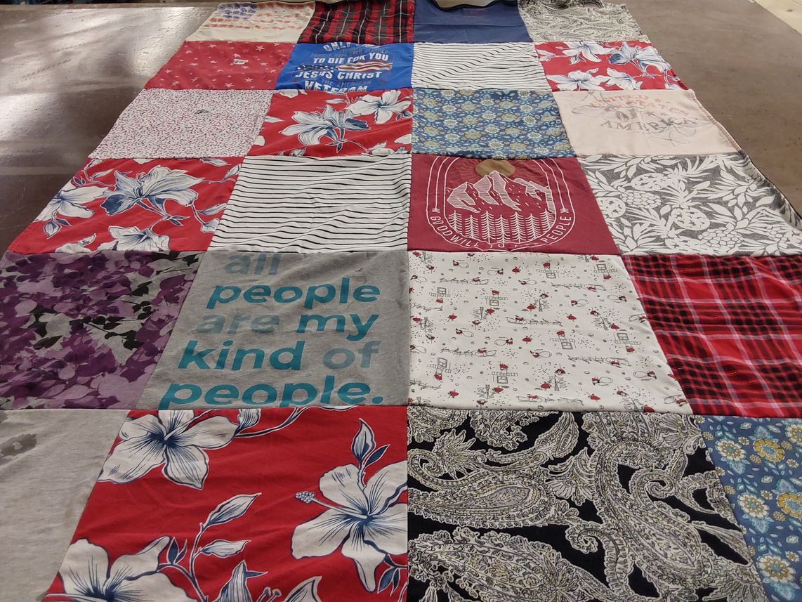 T-shirt quilt with community, social justice themes by Kristen from OK